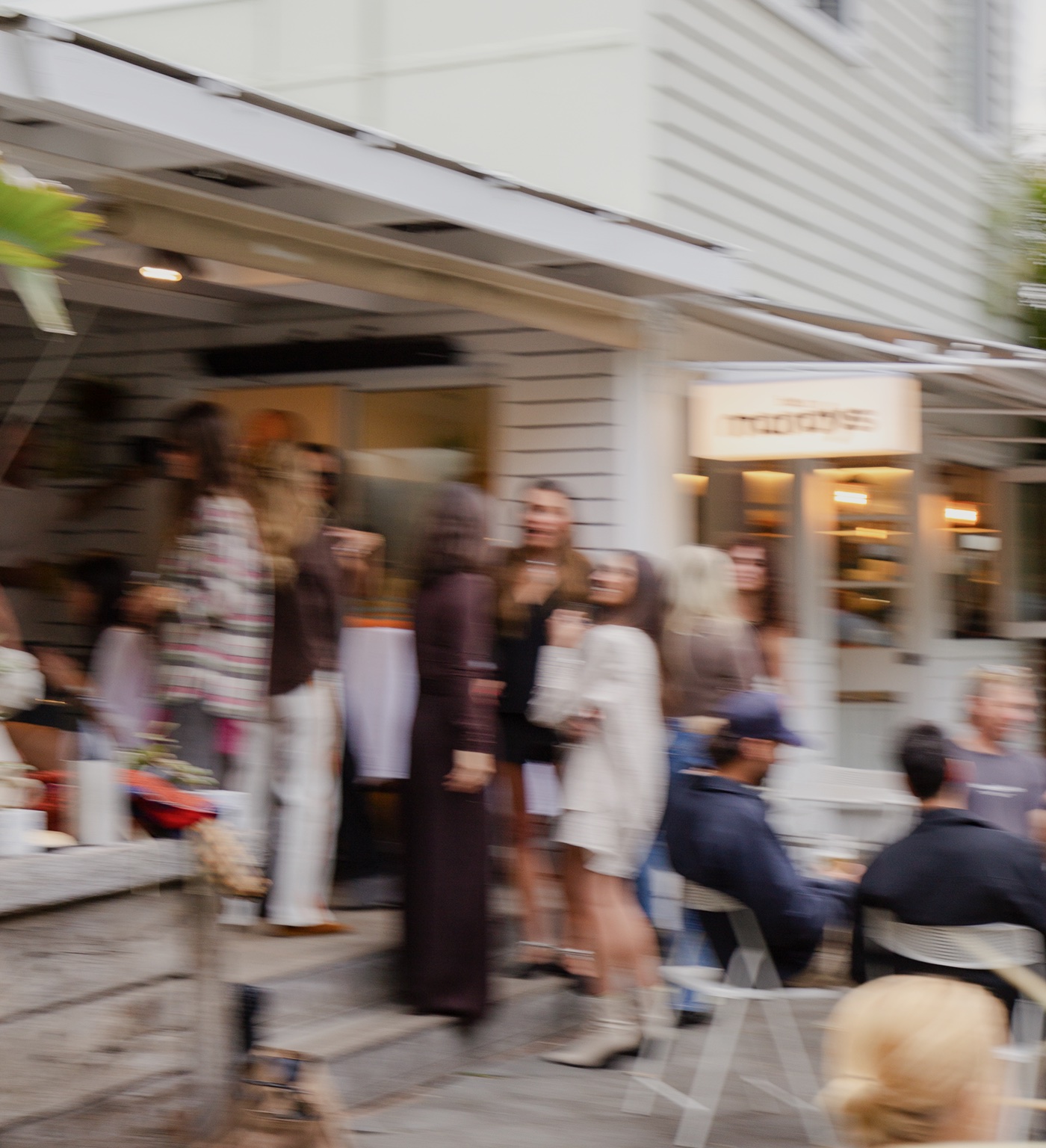 A crowd out the front of bar mandys on Barrenjoey Road